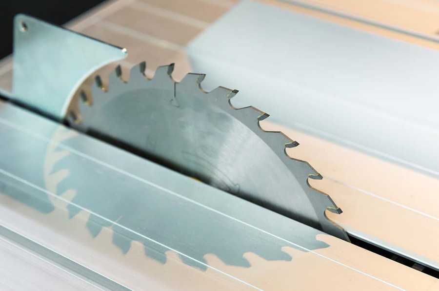 Picture of a table-saw blade protruding from the table